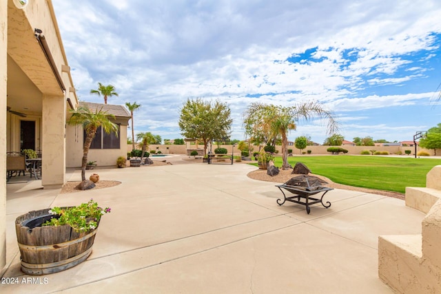 view of patio / terrace featuring a fire pit