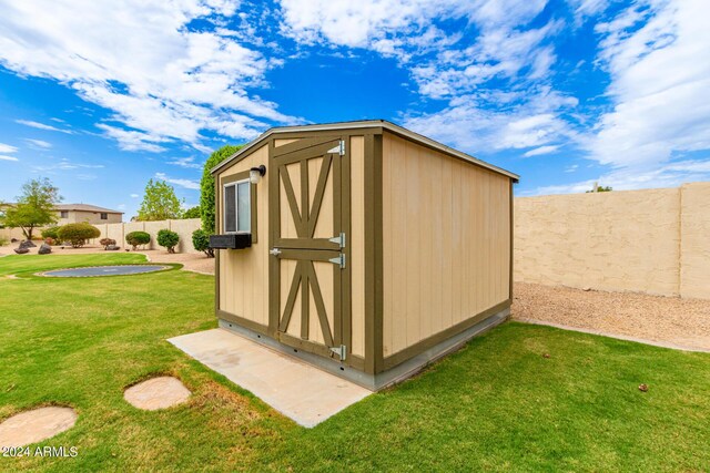 view of shed featuring a fenced backyard