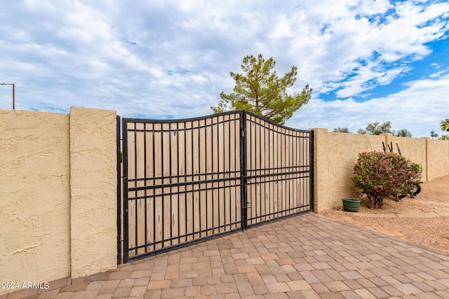 view of gate featuring fence