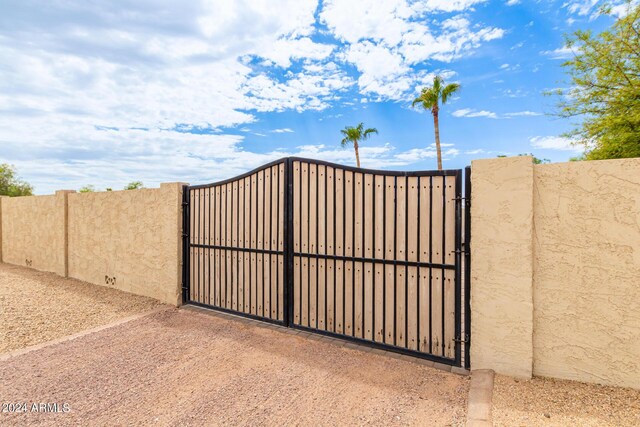 view of gate featuring fence