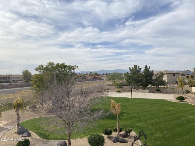 view of yard featuring a patio area and a mountain view