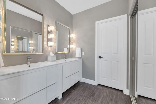 bathroom featuring vanity and hardwood / wood-style flooring