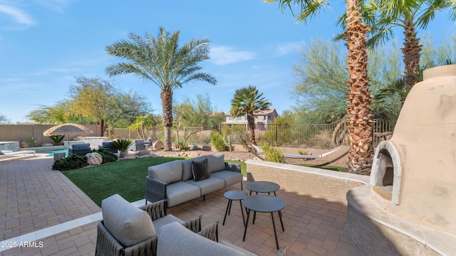 view of patio with a fenced in pool and an outdoor hangout area