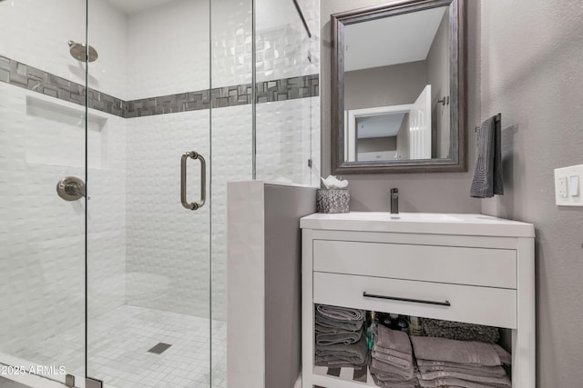 bathroom with vanity and walk in shower