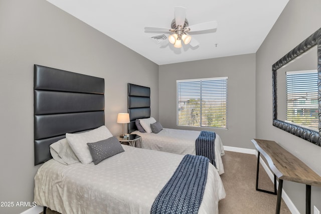 bedroom featuring light colored carpet and ceiling fan