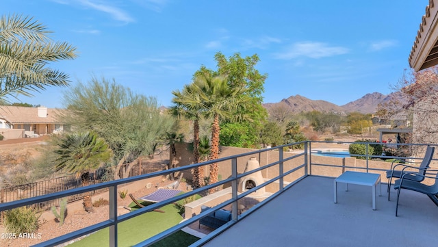 balcony featuring a mountain view