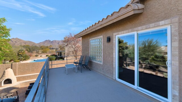 balcony featuring a mountain view