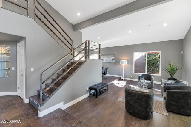 living room featuring beam ceiling and dark wood-type flooring