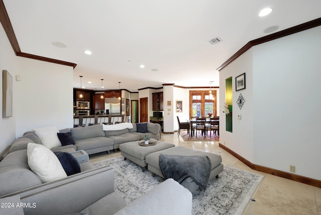 living room with crown molding and light tile patterned floors