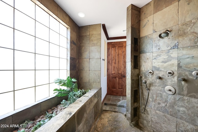 bathroom with tiled shower