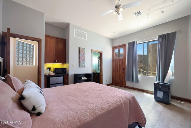 bedroom featuring ceiling fan and light wood-type flooring