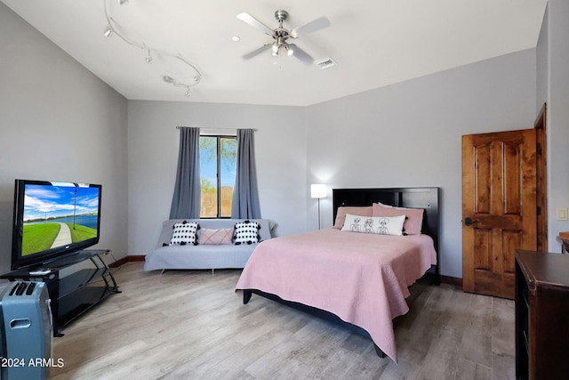 bedroom featuring ceiling fan and light hardwood / wood-style floors