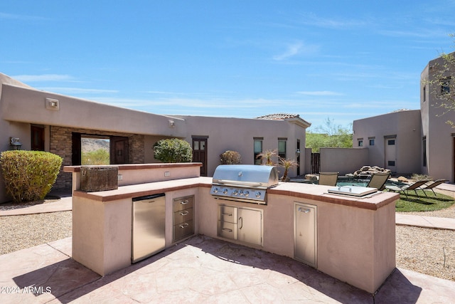 view of patio with area for grilling