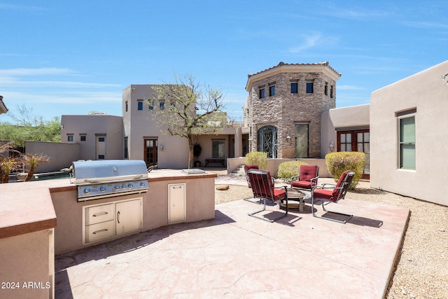 view of patio / terrace featuring exterior kitchen and grilling area