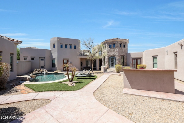 back of property featuring a patio