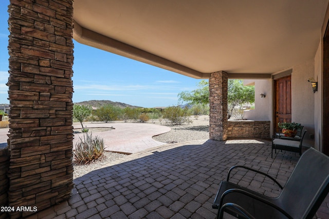 view of patio / terrace with a mountain view