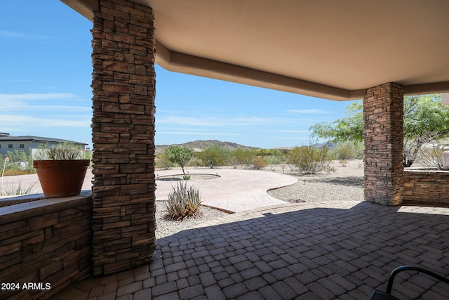 view of patio with a mountain view