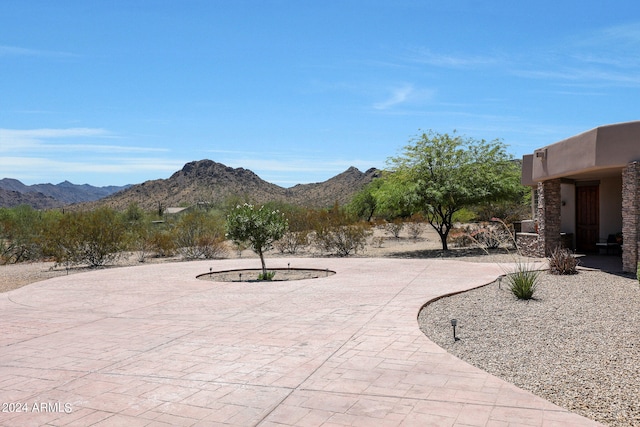 view of patio / terrace with a mountain view