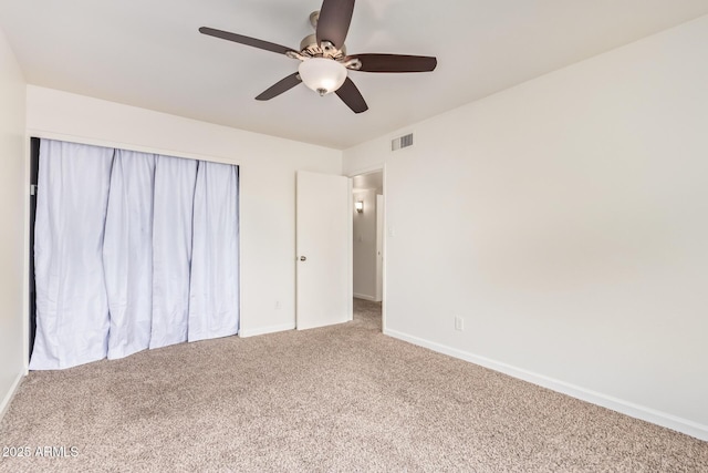 unfurnished bedroom with visible vents, ceiling fan, baseboards, and carpet floors