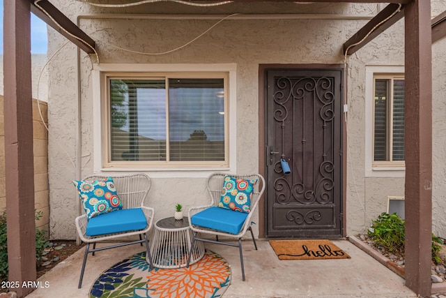 property entrance featuring stucco siding