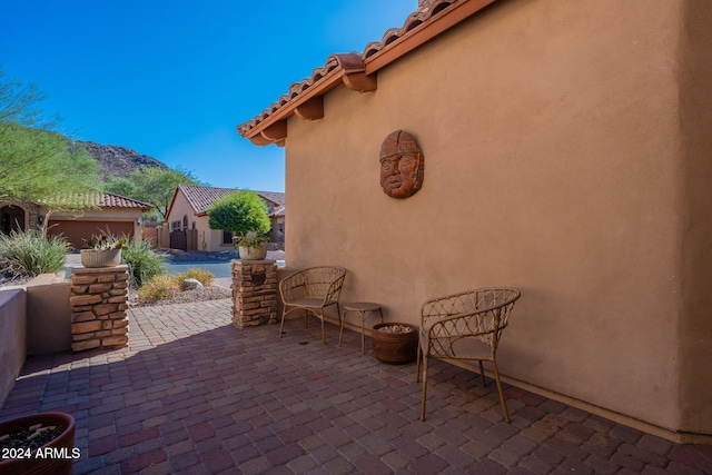 view of patio / terrace featuring a mountain view