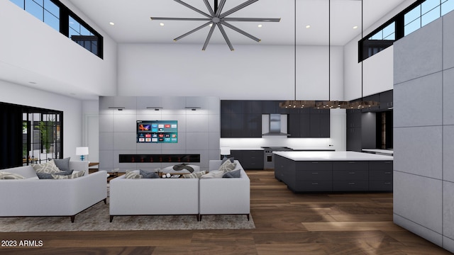 living room featuring dark wood-type flooring and a high ceiling