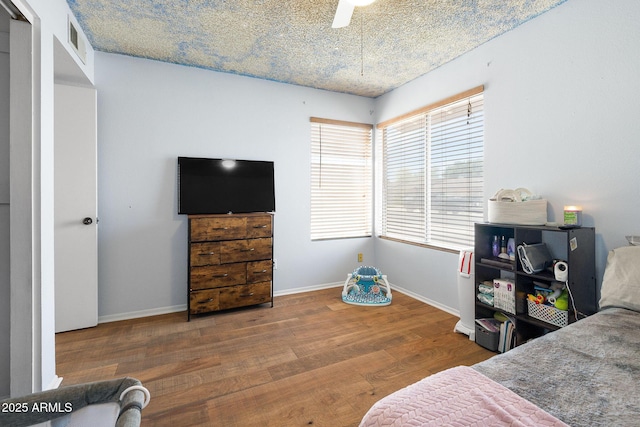 4631 N 77th Dr, Phoenix, AZ 85033 - bedroom featuring baseboards, visible vents, and wood finished floors