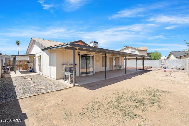 4631 N 77th Dr, Phoenix, AZ 85033 - rear view of property with a playground, a fenced backyard, and a patio area