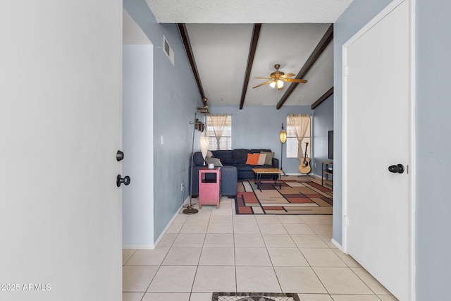 4631 N 77th Dr, Phoenix, AZ 85033 - hallway featuring light tile patterned flooring, baseboards, visible vents, and beam ceiling