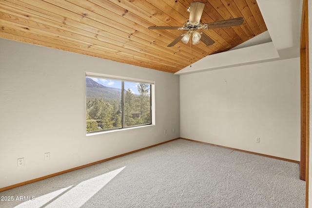 spare room with ceiling fan, wooden ceiling, vaulted ceiling, and carpet flooring