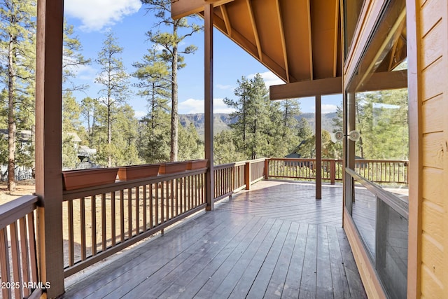 wooden deck with a mountain view