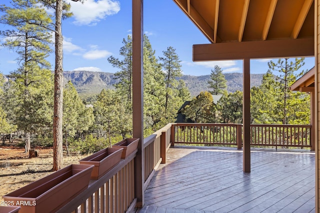 wooden deck featuring a mountain view