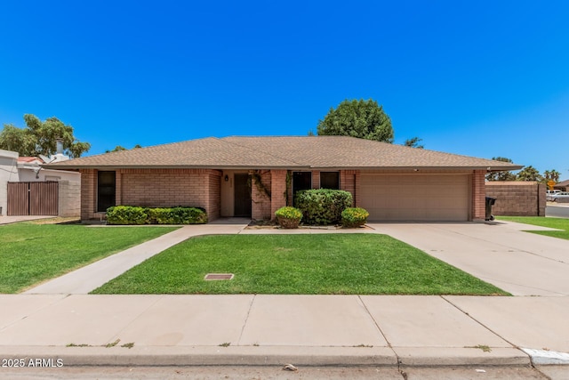 2956 E Concho Ave, Mesa, AZ 85204 - ranch-style home with an attached garage, concrete driveway, brick siding, and a shingled roof