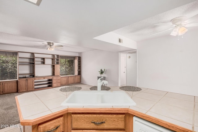 2956 E Concho Ave, Mesa, AZ 85204 - kitchen with a ceiling fan, tile countertops, dishwasher, and a textured ceiling