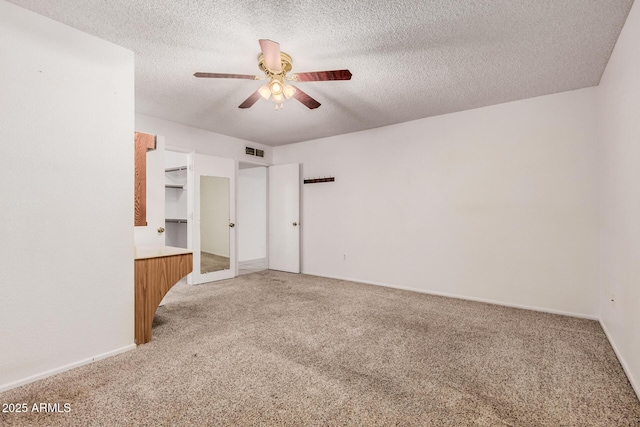 2956 E Concho Ave, Mesa, AZ 85204 - unfurnished bedroom with light colored carpet, a textured ceiling, and ceiling fan