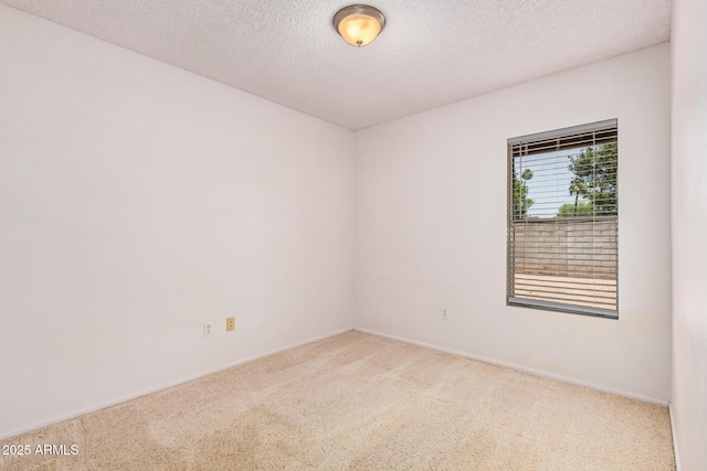 2956 E Concho Ave, Mesa, AZ 85204 - carpeted empty room featuring a textured ceiling and baseboards