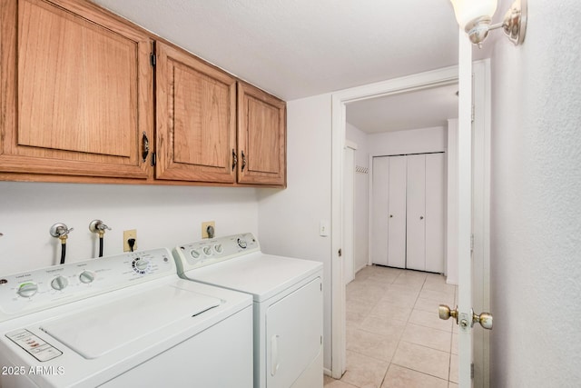 2956 E Concho Ave, Mesa, AZ 85204 - laundry room featuring washing machine and clothes dryer, cabinet space, and light tile patterned floors