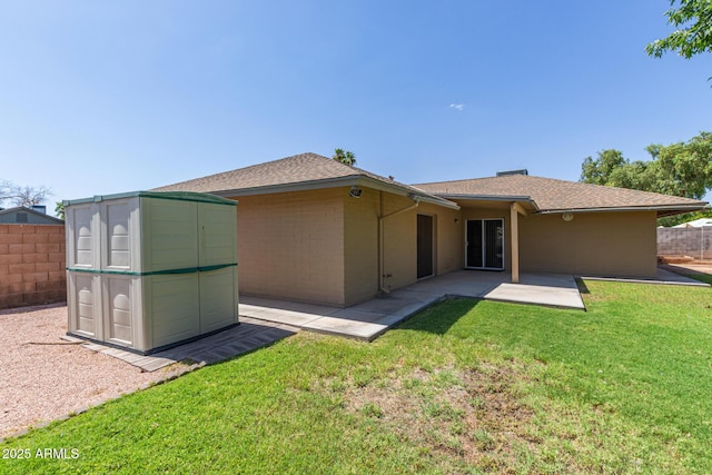 2956 E Concho Ave, Mesa, AZ 85204 - back of property featuring a shed, a patio area, and roof with shingles