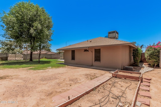 2956 E Concho Ave, Mesa, AZ 85204 - back of property with a fenced backyard, roof with shingles, a chimney, and a garden