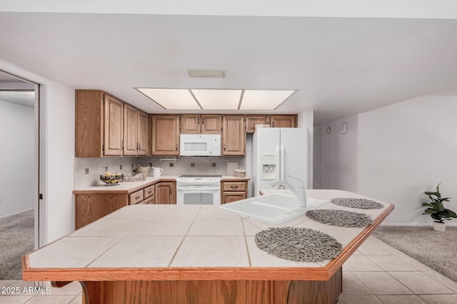 2956 E Concho Ave, Mesa, AZ 85204 - kitchen featuring white appliances, light colored carpet, tile countertops, a kitchen island, and light tile patterned floors