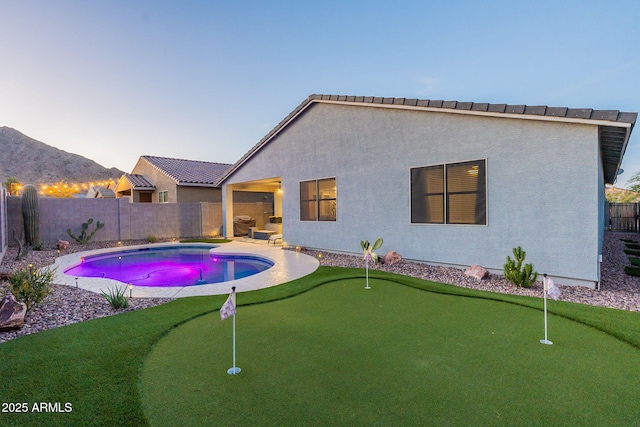 view of swimming pool with a fenced in pool, a fenced backyard, and a patio