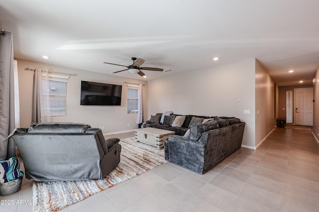 living room featuring recessed lighting, light tile patterned flooring, ceiling fan, and baseboards