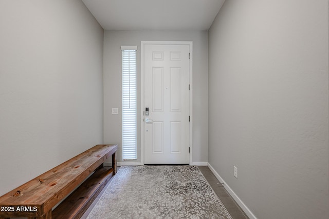 entryway featuring baseboards