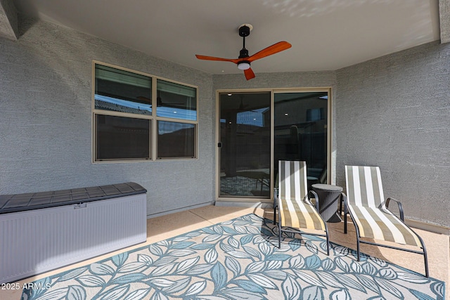 view of patio / terrace featuring ceiling fan