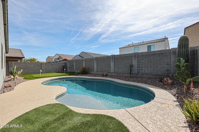 view of swimming pool featuring a fenced backyard