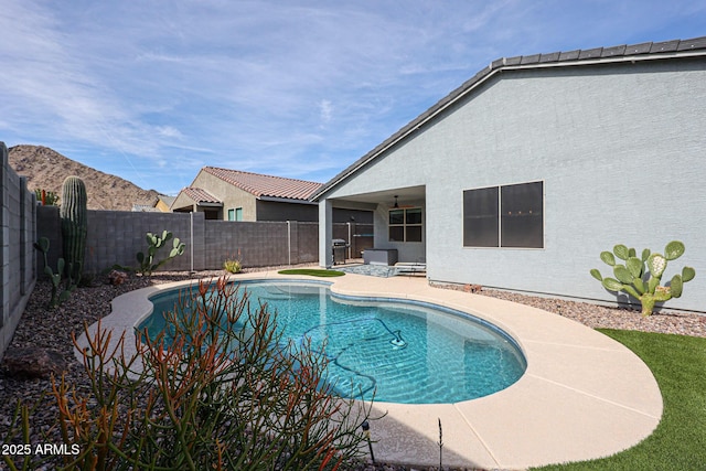 view of pool with a fenced in pool, a patio area, and a fenced backyard