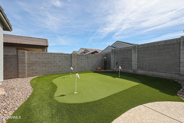 view of yard with a fenced backyard