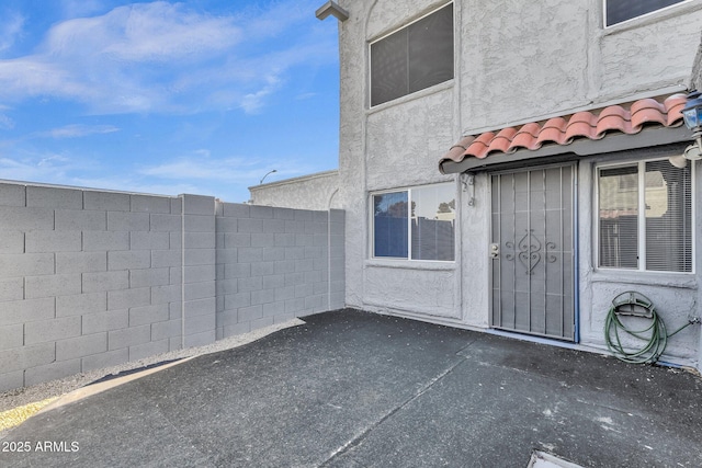 property entrance with a patio