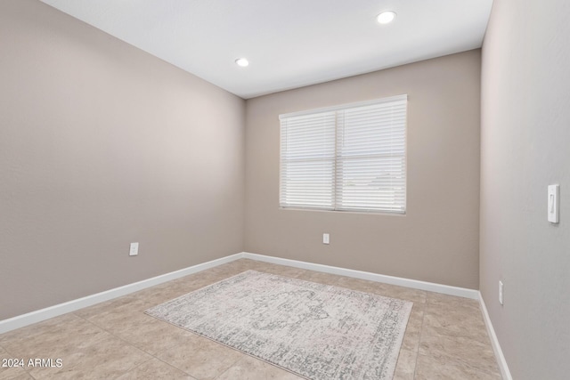 empty room with light tile patterned flooring