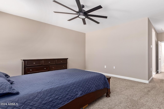 bedroom featuring light carpet and ceiling fan